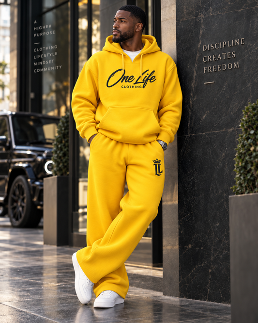 Male model wearing the Yellow ON GO smooth heavyweight hoodie and matching pants