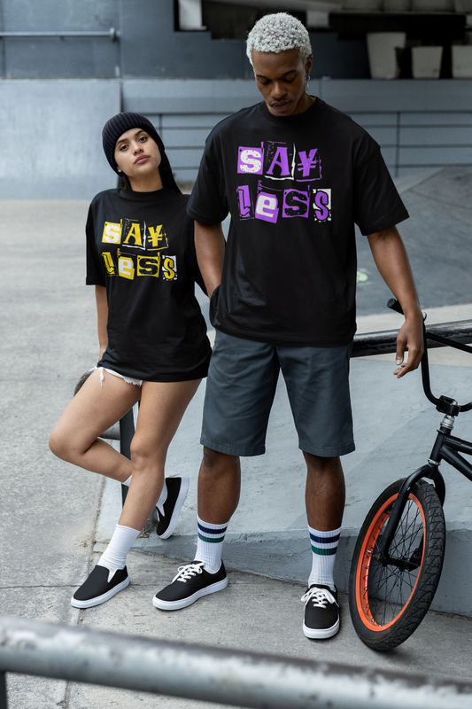 Two people wearing black t-shirts with colorful text, standing outdoors with a bicycle.