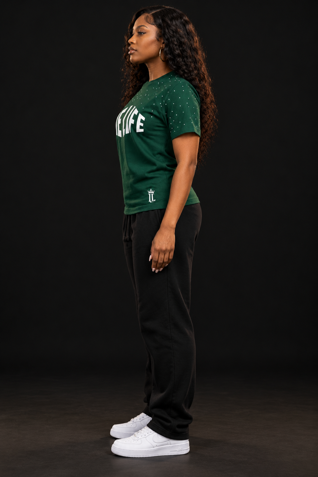 Women's model wearing the Big Money Tee by One Life Clothing — side view.
