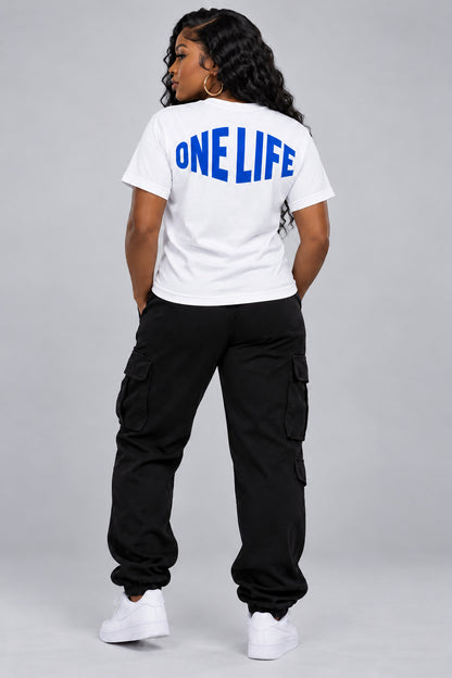 Women’s model wearing the Blue Blood Tee — back view. No back rhinestones.