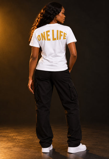 Women's model wearing the Crown Jewel Tee by One Life Clothing — back view.