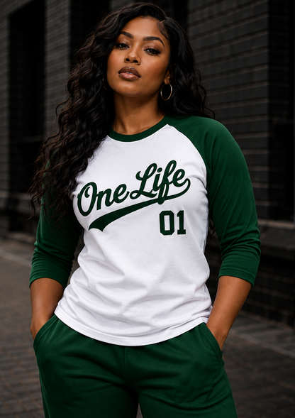 Women's model wearing the Evergreen Baseball Tee by One Life Clothing — front view.