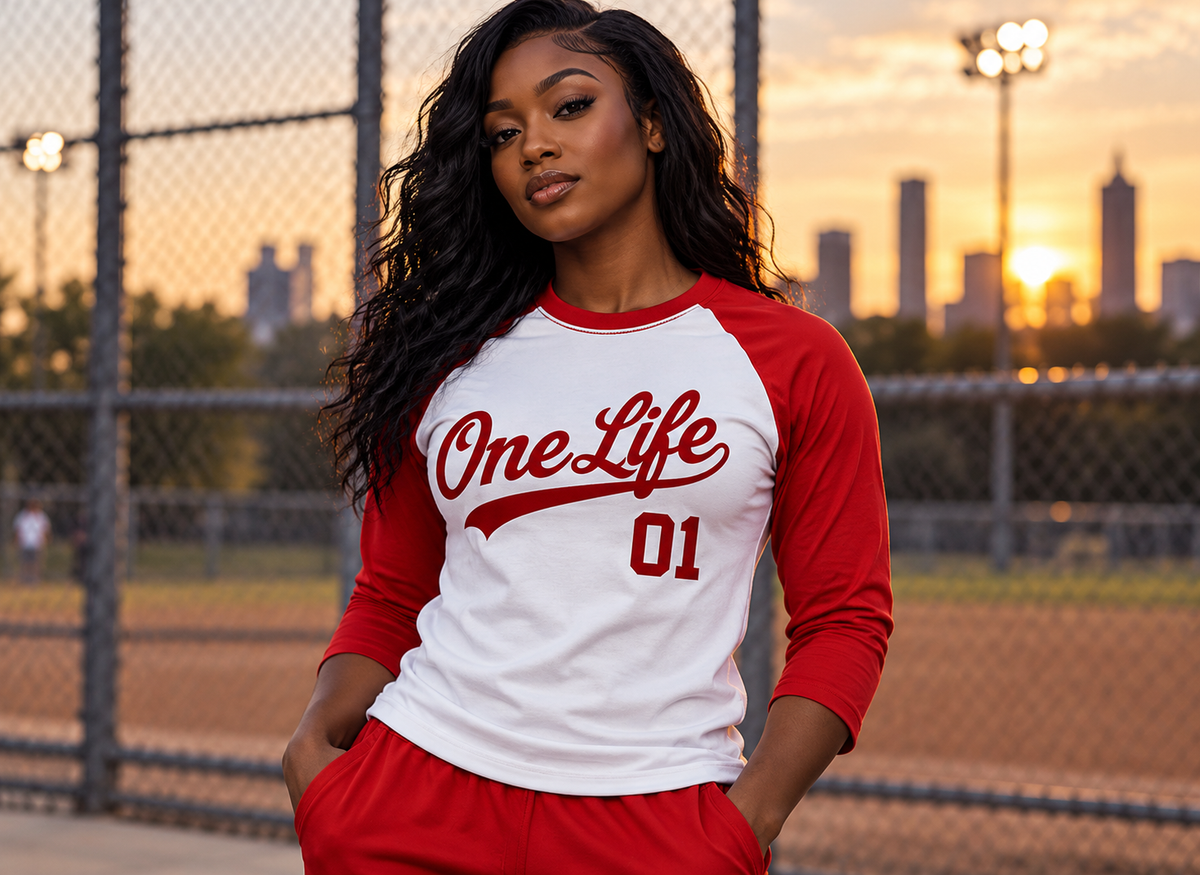 Women's model wearing the First Inning Baseball Tee by One Life Clothing — front view.