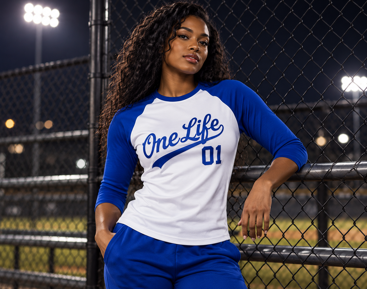 Women's model wearing the Horizon Baseball Tee by One Life Clothing — front view.