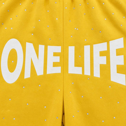 Lemon Pepper Shorts by One Life Clothing - front logo and rhinestone detail
