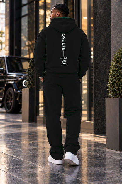 Male model wearing the Black ON GO Set, back with STAY ON GO artwork