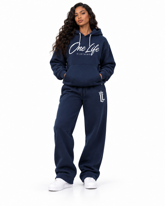 Female front view of the Navy ON GO smooth heavyweight hoodie and matching pants