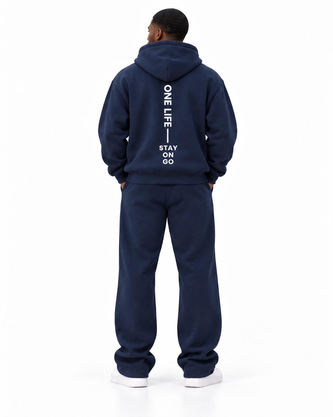 Male back view of the Navy ON GO smooth heavyweight hoodie and matching pants