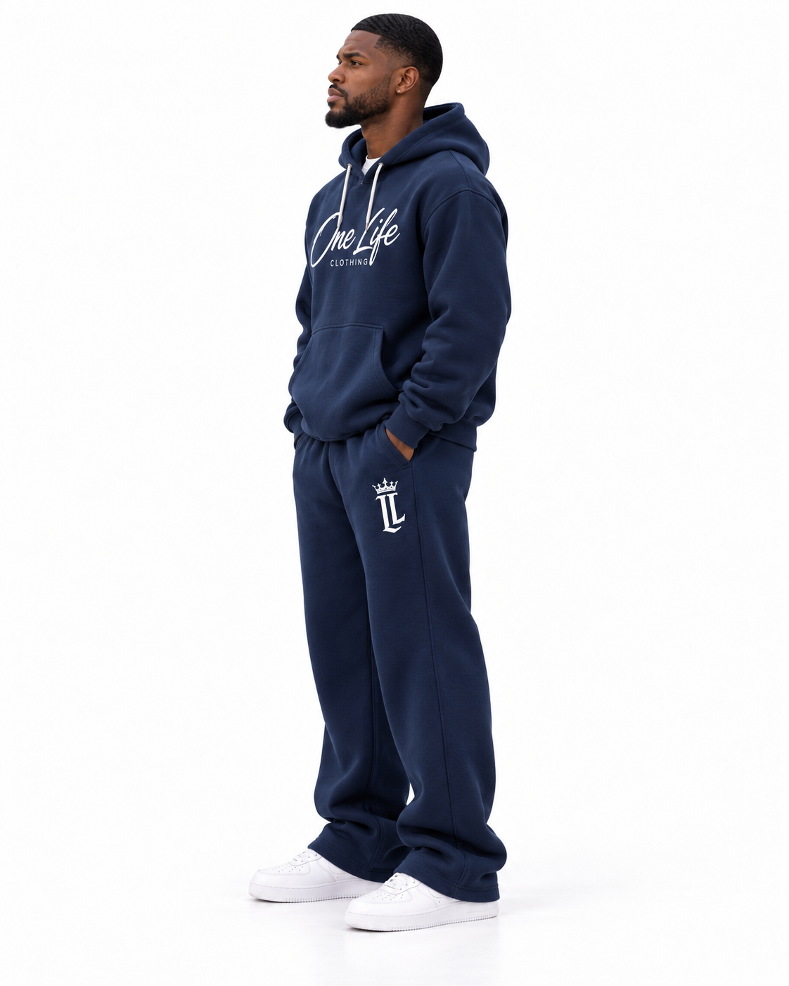 Male side view of the Navy ON GO smooth heavyweight hoodie and matching pants