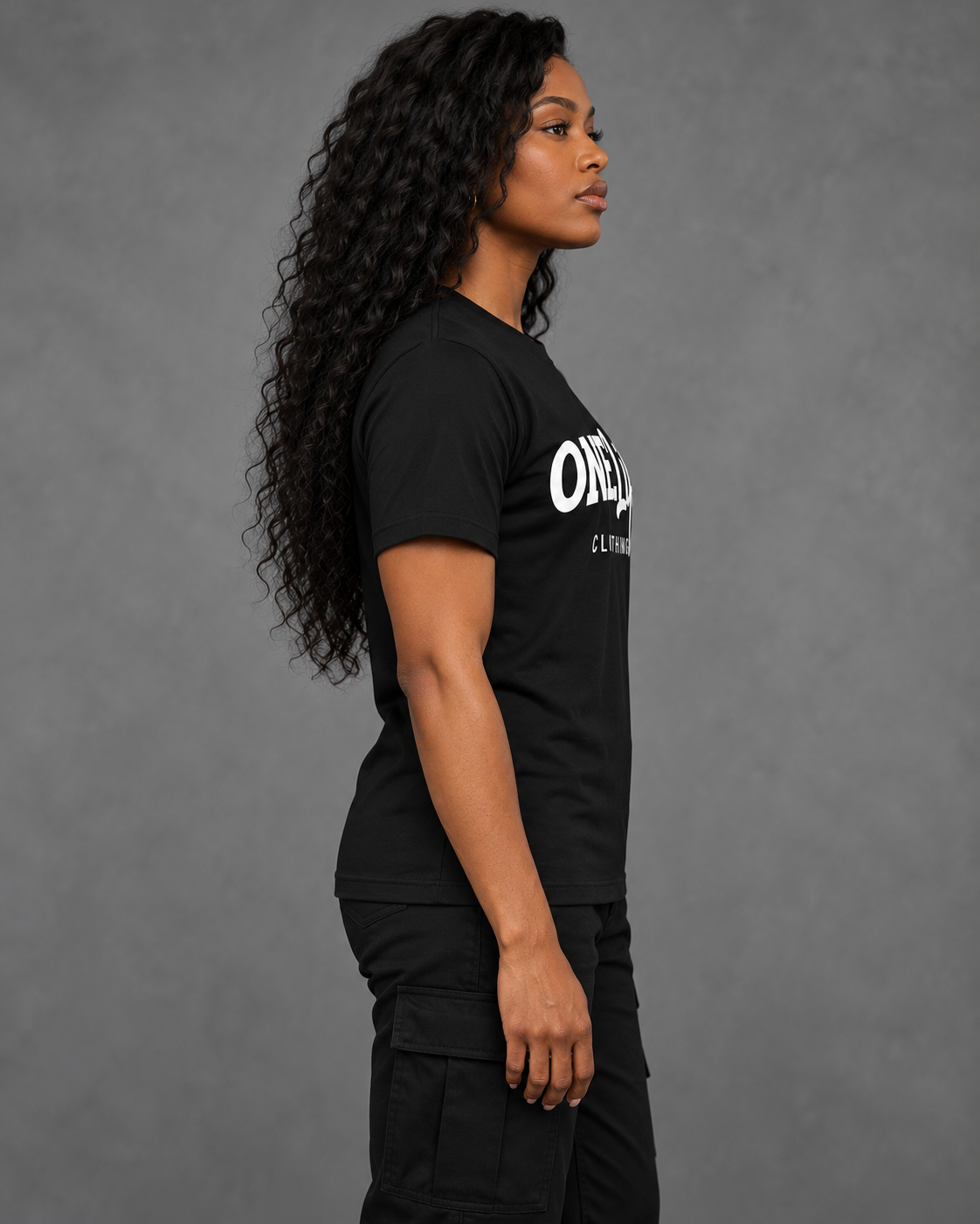 Women's model wearing Royal Standard Tee — side view